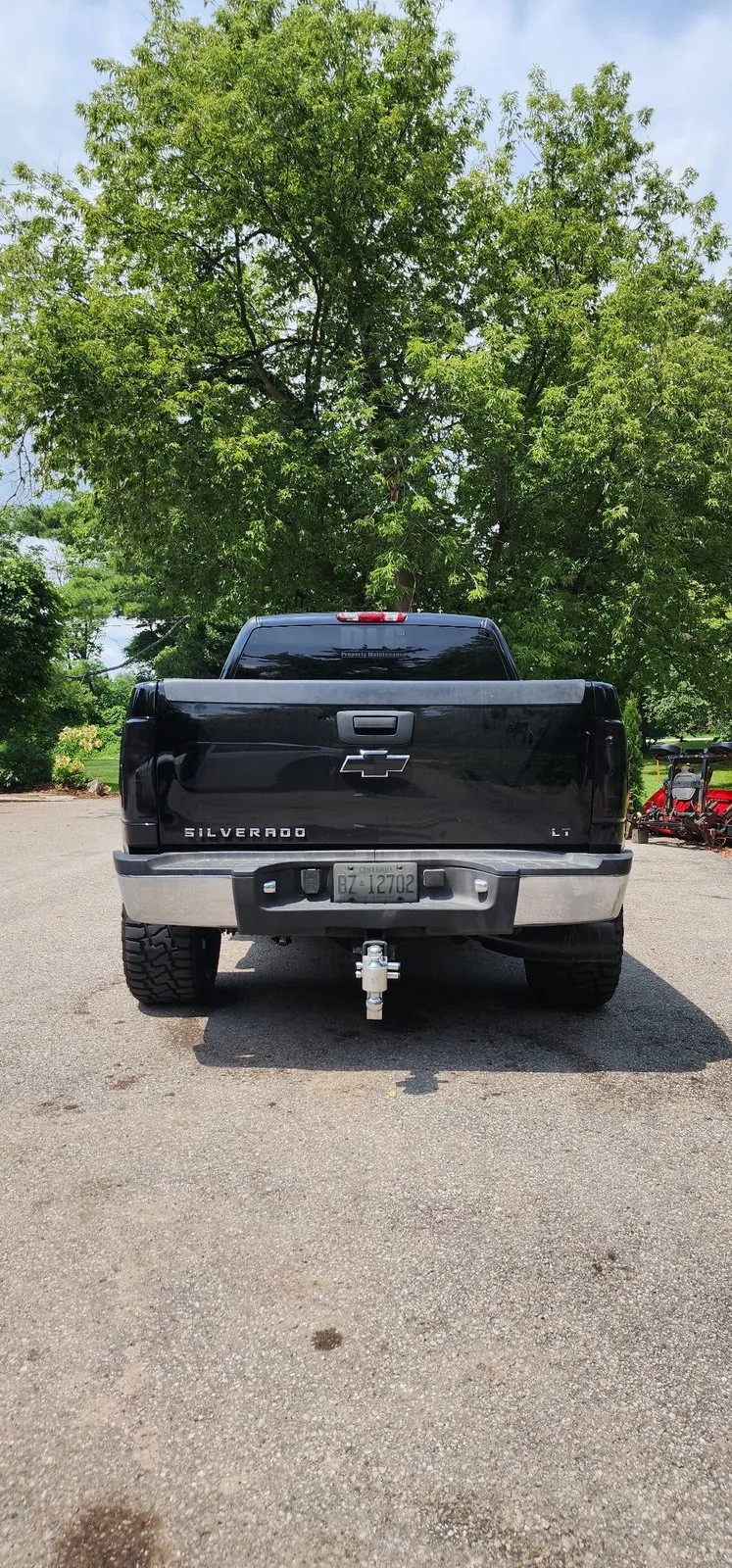 Smoked taillight tint on the rear of a black Silverado