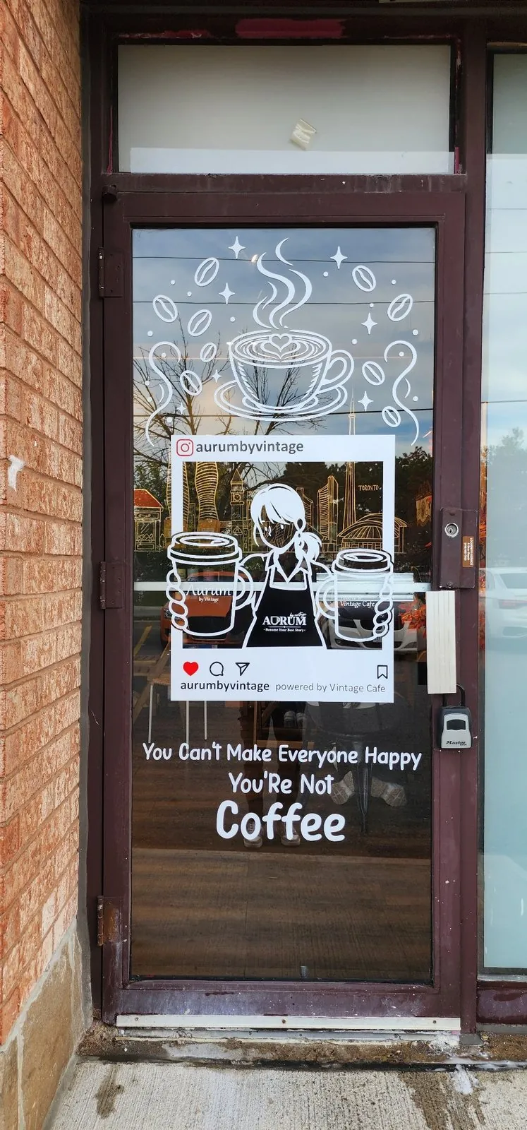Coffee shop entry door with custom white vinyl artwork by Apex Alpha Graphix