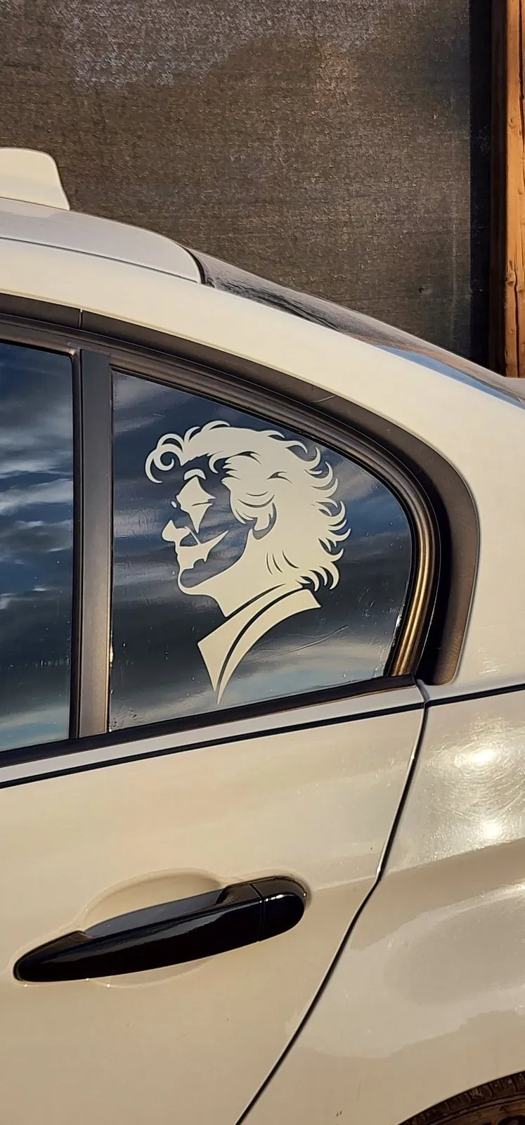 Custom portrait vinyl decal on a car side window