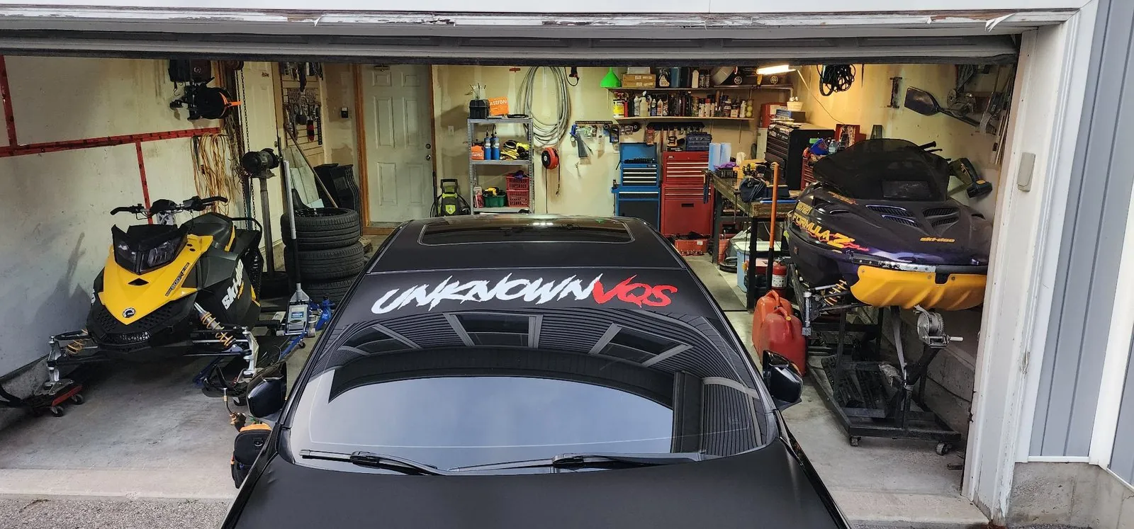 Finished windshield banner job photographed at a shop