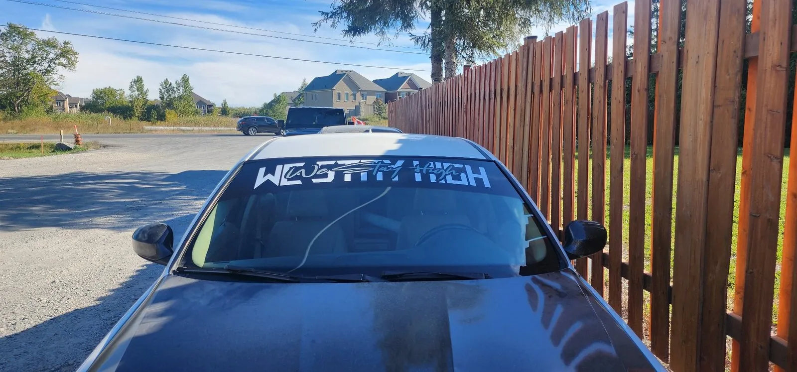 Custom text windshield banner on a car
